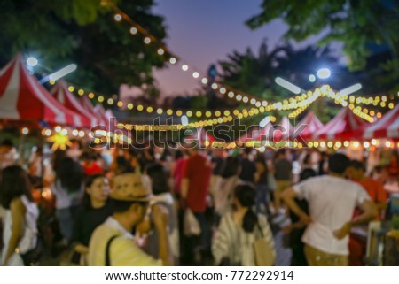 Blurred picture of market night festival in the park