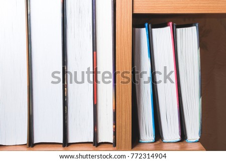 School books for education lie on the shelf.