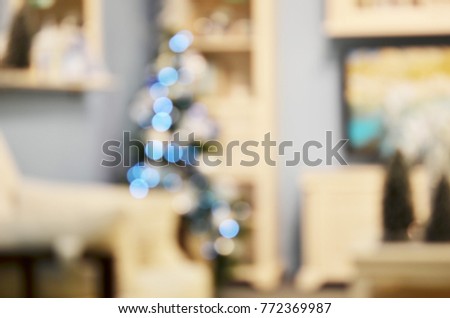 Holiday decorated room with Christmas tree out of focus shot for photo background