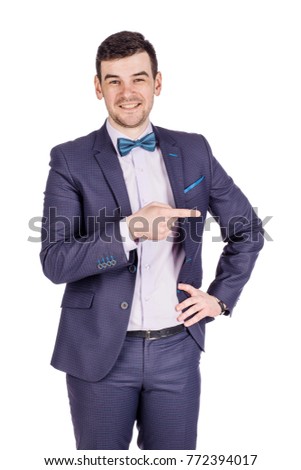 Portrait adult businessman  looking and pointing finger  gesture . happiness, gesture, emotions and people concept. Image on white  studio background.