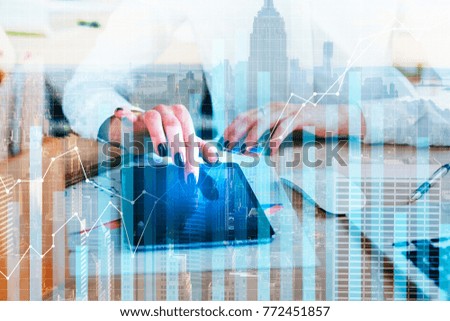 Businesswoman hands using tablet at modern office desktop with supplies and abstract city view. Accounting and finance concept. Double exposure 