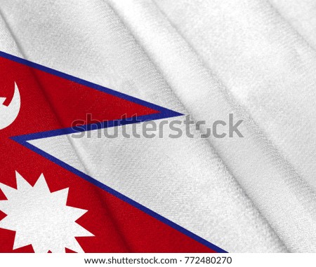 Realistic flag of Nepal on the wavy surface of fabric