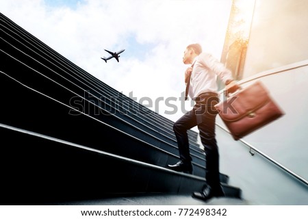 Successful businessman  running fast upstairs Success concept Royalty-Free Stock Photo #772498342