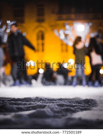 Skaters on the Ice Rink in the Centre of Bruges Belgium on a Cold December Evening