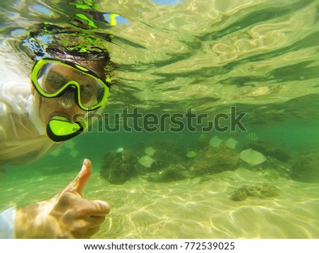 A Woman snorkeling in the Indian Ocean