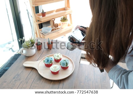Girl shooting cake photo