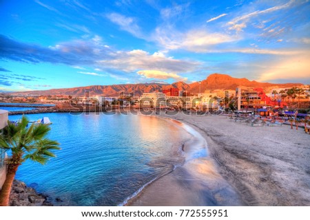Pinta beach with colorful  architecture illuminated at sunset, in Tenerife, Canary island, Spain