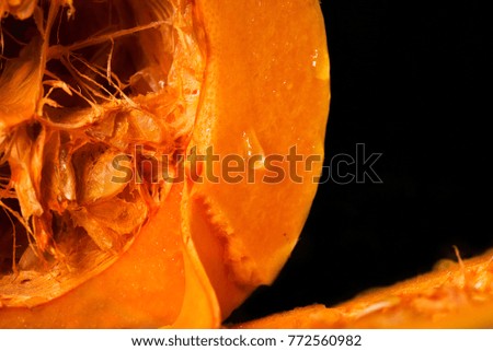 Pumpkin close-up with a drop of water.
