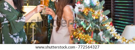 party, drinks, holidays, people and celebration concept Picture showing group of friends celebrating Christmas at home
