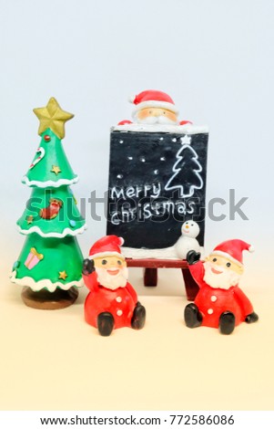 Santa Claus with board Merry Christmas for decoration and background by yellow tone
