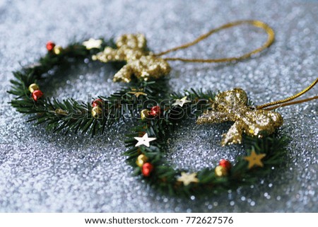 Green christmas wreath decoration closeup blur glittering background