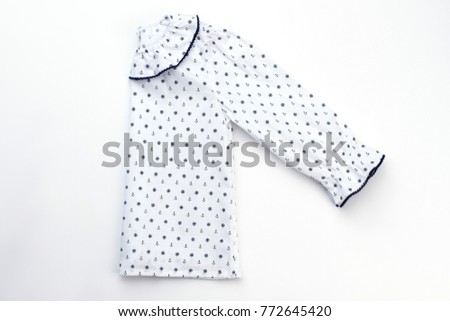 White pajama top for girl. Simple jacket decorated with nautical pattern and edging. Cozy and beatiful garment for comfy sleep.