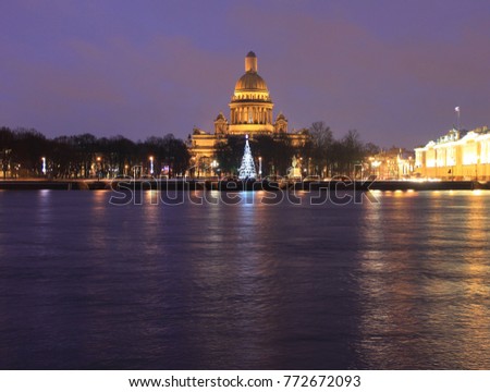 St. Isaac's Cathedral View from Neva River Embankment Illuminated Christmas Time Architecture at Night in Saint-Petersburg, Russia. Beautiful Night Time Cityscape Scene of Historical Old Downtown City