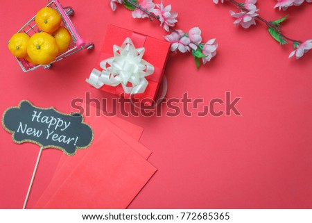 Top view shot of arrangement decoration Chinese new year & lunar festival background concept. DIY photo booth props also red packet money with ornament on backdrop space.Idea for shopping in holiday