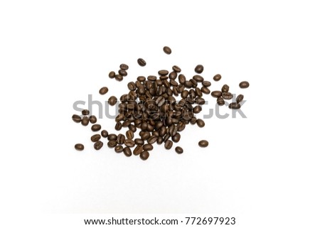 Roasted coffee beans isolated on white background. Close up image and high resolution.