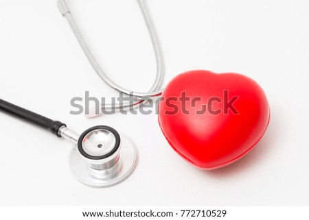 Red heart and a stethoscope. Isolated on white background. Studio lighting. Concept for healthy and medical
