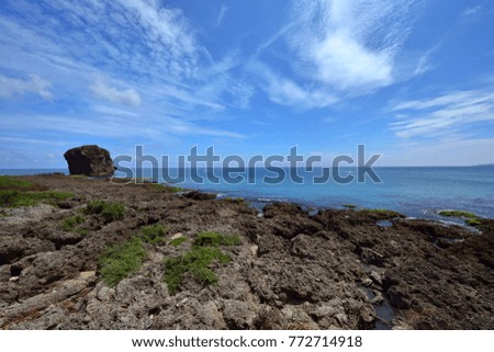 Taiwan Pingtung City waterfront rocks and rocks, in the blue sky is a beautiful picture and journey.