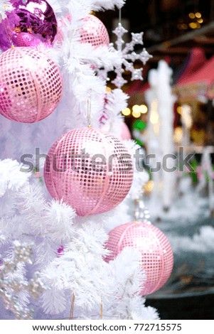colorful ornaments on white christmas tree