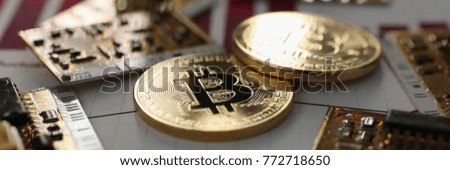 Coin crypto currency bitcoin against the background of a changing chart subject gold exchange pyramid for money in connection with the growth or fall exchange rate closeup.