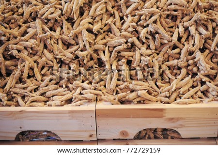Close up shot of the Dried Ginseng root in the wooden box.Ginseng is good for medical and health purpose.Chinese medical herb.