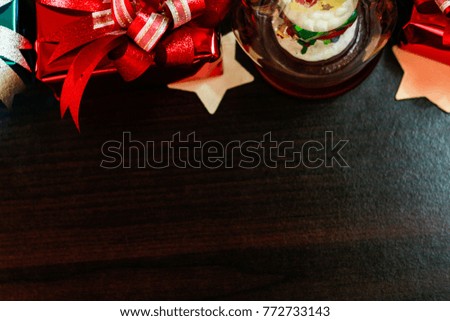 Christmas concept background with decorations and gift boxes and star on wooden boards with copy space,Image Style Vintage and Film Tone.