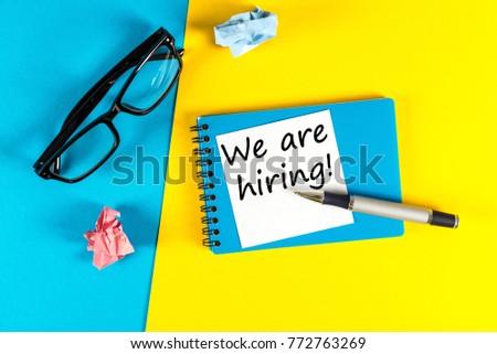 WE ARE HIRING CONCEPT ON bright background at new job place