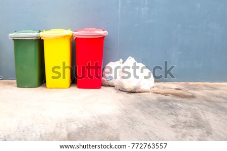 Green yellow and red Garbage containers for recycling .