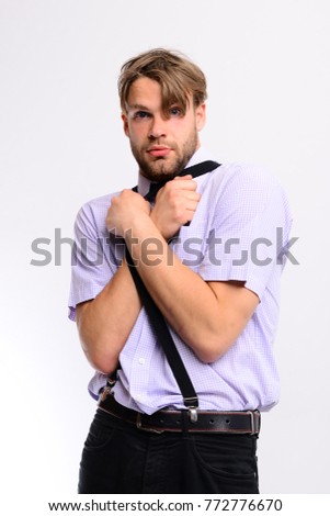 Man with scared face isolated on white background. Guy wearing suspenders and jeans. Student in trouble posing with bristle and fair hair. Oldfashioned style and youth concept