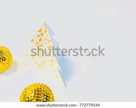 Christmas trees made of paper cut. Minimalist New Year golden year concept. Vivid tone.