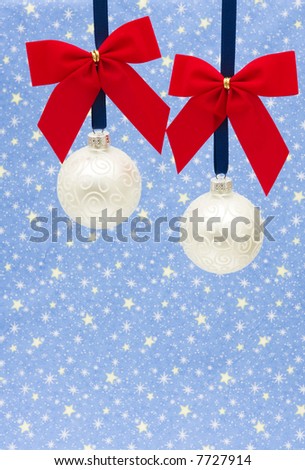 Two white glass Christmas ball ornaments