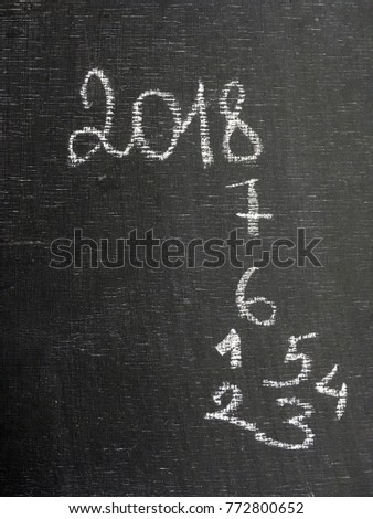 concept 2018 chalk text on blackboard. 2018 after 2017 and 2016