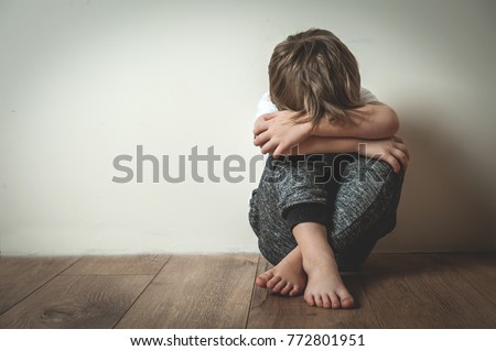 Boy shouts covered his face with his hands. Stressed child. Domestic Family violence and aggression concept violence. concept for bullying, depression stress or frustration. Royalty-Free Stock Photo #772801951
