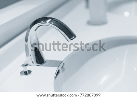clean new water tap or chrome faucet washbasin.