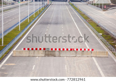 Barricade on a highway stopping all vehicles.