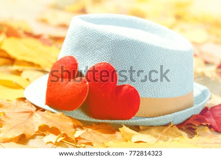 Valentines day background abstract symbol. Two heart in leaves. Concept of love with hat hipster