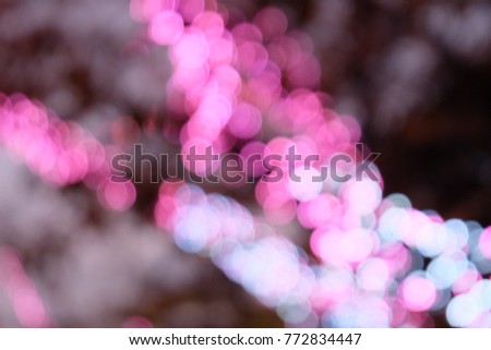 Bokeh Pink light dot in christmas and new year decoration Sakura tree,Light abstract beautiful background