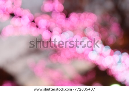 Bokeh Pink light dot in christmas and new year decoration Sakura tree,Light abstract beautiful background