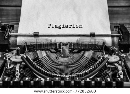 plagiarism, Copyright printed on an old typewriter. Black retro vintage aged typewriter. Close up. Royalty-Free Stock Photo #772852600