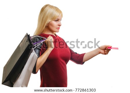 Happy shopping beautiful young woman holding colored shopping bags isolated on white background