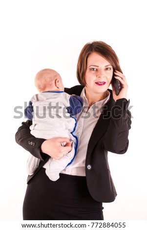 Young working mom carrying her baby in one hand isolated