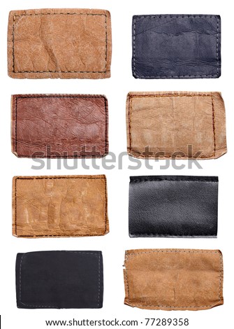 collection of various jeans labels on white background. each one is shot separately