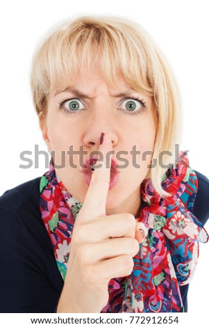 Angry woman wide eyed asking for silence or secrecy with finger on lips hush hand gesture on white background. Pretty woman placing fingers on lips shhh sign symbol. Negative emotion face expression