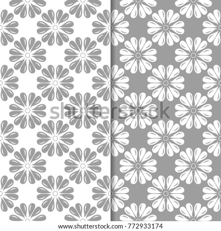 White and gray floral ornamental designs. Set of seamless patterns for textile and wallpapers