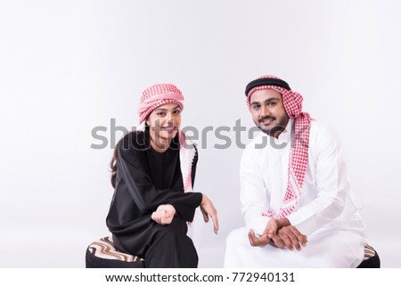 Arab muslim couple togother at home with white background