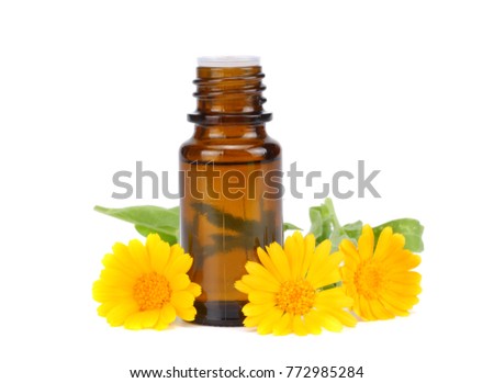 aromatherapy essential oil with marigold flowers isolated on white background