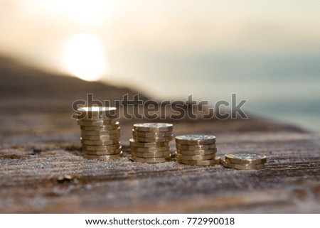 Picture of four piles  British pound coins. UK Money, New Pounds in a Warm Light. 