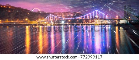 Evening and night on the great Ukrainian river Dnieper with a panorama of the Pedestrian bridge in Kiev in Ukraine illumination of the colored lights of the capital on the hills
