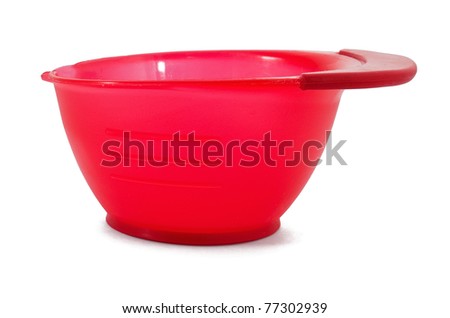 Red measuring plastic bowl on white background