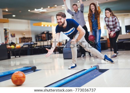 Friends bowling at club