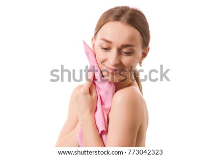 Beautiful young woman beauty face wiping her face with a towel spa cosmetology on white background isolation